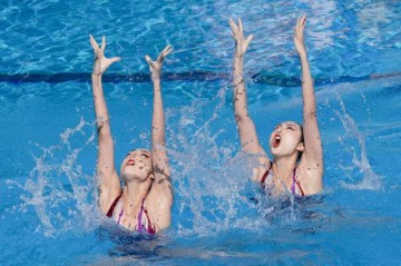 九游娱乐-首金!双胞胎姐妹强势夺冠 中国花游新周期仍给力